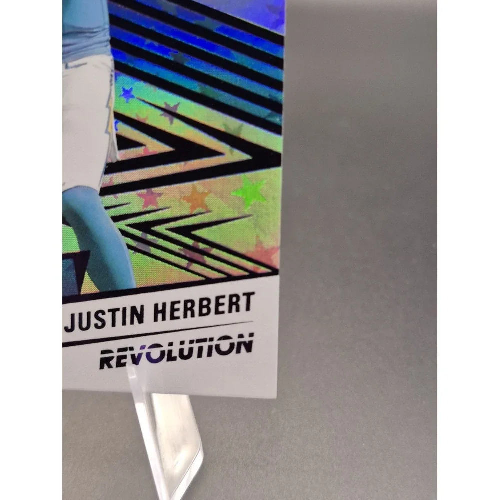 2025 Panini Revolution Justin Herbert #46 Purple Astro /199 Los Angeles Chargers